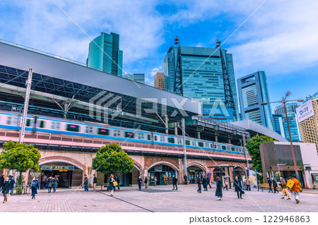 Tokyo cityscape in Japan in February. View of the Hibiya exit of Shimbashi Station and trains. A ray of hope... = 5th 122946863
