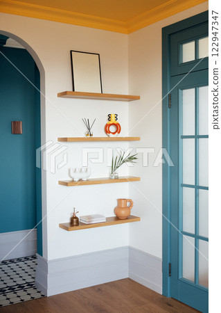 Close-up details of a stylish home interior. Wooden shelves Close-up details of a stylish home interior. Wooden shelves 122947347