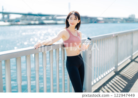 Outdoor fitness image of young woman 122947449