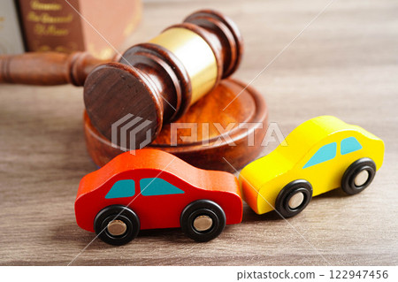 Car accident lawsuit and insurance, Judge hammer with car model. Car accident lawsuit and insurance, Judge hammer with car model. 122947456