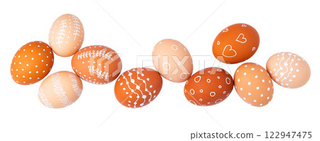 Natural brown Easter eggs with white minimalist patterns (hearts, dots, and lines) 122947475