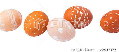 Natural brown Easter eggs with white minimalist patterns (hearts, dots, and lines) Natural brown Easter eggs with white minimalist patterns (hearts, dots, and lines) 122947476