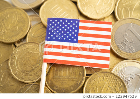 USA American flag on coins background, finance and accounting, banking concept. 122947529