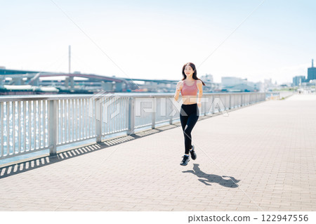 A young lad who jogs 122947556
