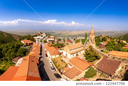 Aerial view on St. George's Church and Alazani valley, Georgia, Kakheti region, Signagi village. Sighnaghi city of love on hill near Gombori Range. Drone Photography in sunny summer day. 122947706
