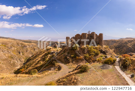 Aerial view of ancient destroyed fortress of Amberd and Vahramashen Church on Mount Aragats on sunny day. Popular tourist and historical attraction and landmark. Aragatsotn Province, Armenia. Europe. 122947716
