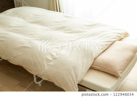 Bedroom futon, bed, mattress and pillow 122948034