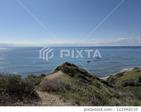 Scenic beach and rock formations in Cyprus. Mediterranean Sea, road, travel, view of mountains and sea. 122948210