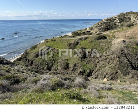 Scenic beach and rock formations in Cyprus. Mediterranean Sea, road, travel, view of mountains and sea. 122948211