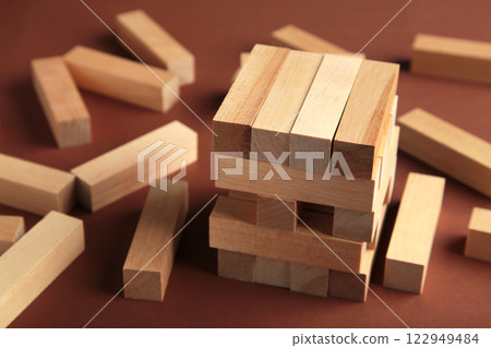Blocks of wood on brown background, Strategy game as a business plan for team work 122949484