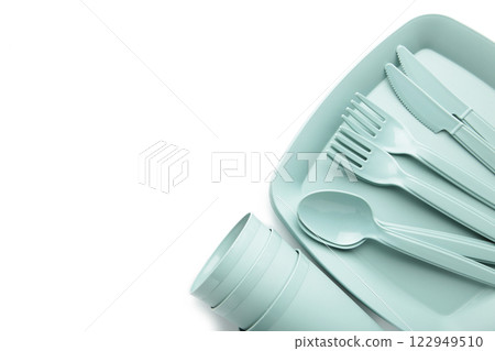 Bright plastic disposable tableware isolated on white background. Top view 122949510