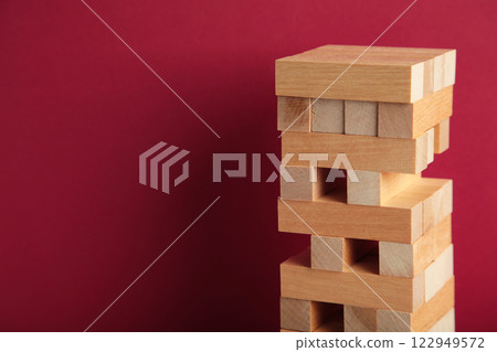 Blocks of wood on red background, Strategy game as a business plan for team work Blocks of wood on red background, Strategy game as a business plan for team work 122949572