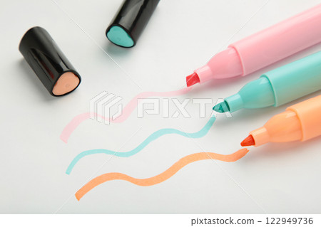 Text markers and painted waves on white. 122949736