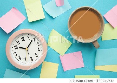 Alarm clock and stickers with space for text on a blue background Alarm clock and stickers with space for text on a blue background 122949738