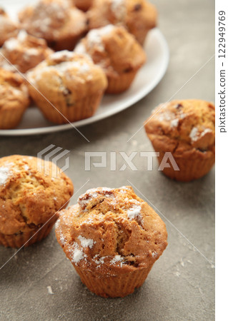 Vanilla muffins. Sweet cupcakes on white plate. Top view. Vanilla muffins. Sweet cupcakes on white plate. Top view. 122949769