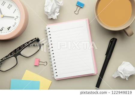 To do list written in a notebook. Notebook with an to do list on grey with cup of coffee and clock 122949819