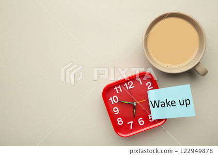 Red clock with coffee and inscription Wake up on grey background. 122949878
