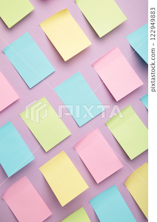 Colorful sticky notes on purple background. Vertical photo Colorful sticky notes on purple background. Vertical photo 122949883