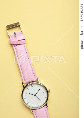 Pink wrist watches on beige background with copy space. 122949884