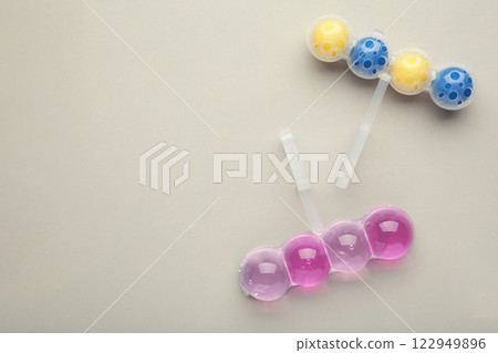 Toilet cleaner on grey background. Toilet balls Toilet cleaner on grey background. Toilet balls 122949896