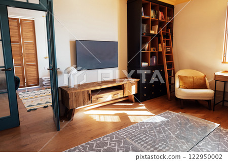 Close-up details of an elegant armchair made of orange fabric and wooden elements Close-up details of an elegant armchair made of orange fabric and wooden elements 122950002