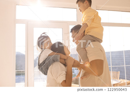 Young Korean parents are holding their cute little children 122950043