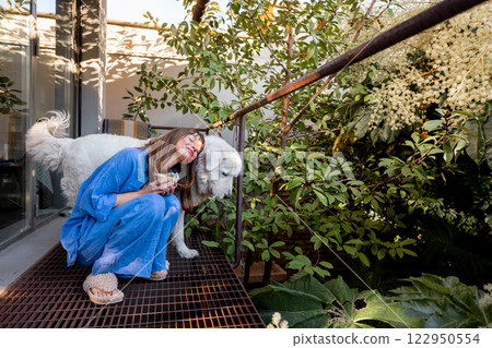 Woman and Dog Enjoying Nature 122950554