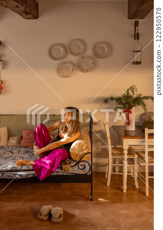 Cozy Rustic Interior with Relaxing Woman Cozy Rustic Interior with Relaxing Woman 122950578