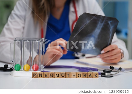 Doctor Conducting an InDepth Analysis of Chest XRay for Accurate Pneumothorax Diagnosis Doctor Conducting an InDepth Analysis of Chest XRay for Accurate Pneumothorax Diagnosis 122950915