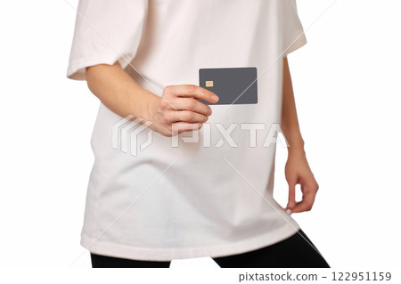 woman in white t-shirt showing black premium credit bank card on white background. credit card for online payment woman in white t-shirt showing black premium credit bank card on white background. credit card for online payment 122951159