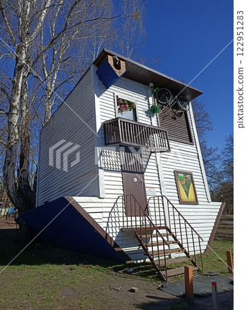 Kyiv, Ukraine March 27, 2024: Art - House built in reverse - foundation up, roof down Kyiv, Ukraine March 27, 2024: Art - House built in reverse - foundation up, roof down 122951283