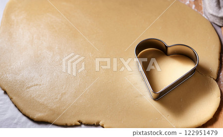 the of Baking Heart Shaped Cookies with a Butter Cookie Cutter P 122951479