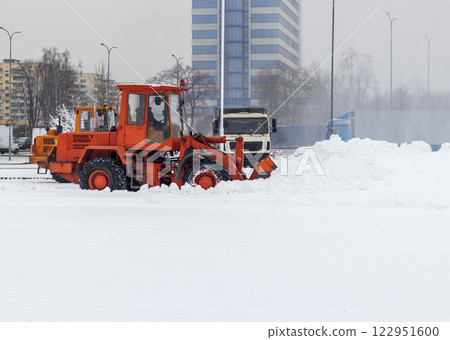 Heavy machinery cleaning the snow after heavy snowfall 122951600