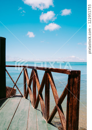 Vung Tau Beach with Blue Sky Flowers and Mother Mary Statue Scenic Coastal View with Coffee Shop Nearby High quality photo Vung Tau Beach with Blue Sky Flowers and Mother Mary Statue Scenic Coastal View with Coffee Shop Nearby High quality photo 122951755