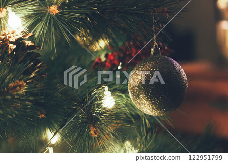 Christmas Tree with Book and Nativity Scene Festive Holiday Decorations and Cozy Seasonal Atmosphere. High quality photo 122951799