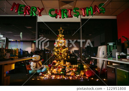 Nativity Scene with Christmas Tree and Balloon Decorations in Office Festive Atmosphere with Santa Claus. High quality photo 122951808