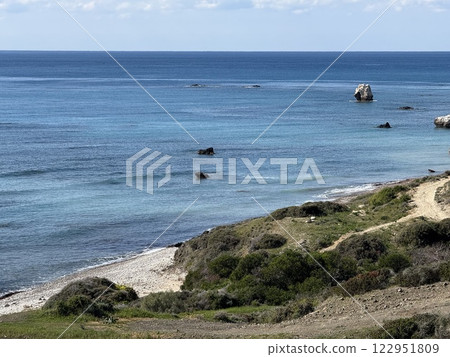 Scenic beach and rock formations in Cyprus. Mediterranean Sea, road, travel, view of mountains and sea. Scenic beach and rock formations in Cyprus. Mediterranean Sea, road, travel, view of mountains and sea. 122951809