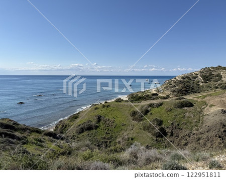 Scenic beach and rock formations in Cyprus. Mediterranean Sea, road, travel, view of mountains and sea. Scenic beach and rock formations in Cyprus. Mediterranean Sea, road, travel, view of mountains and sea. 122951811