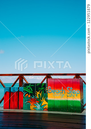 Vung Tau Beach with Blue Sky Flowers and Mother Mary Statue Scenic Coastal View with Coffee Shop Nearby High quality photo 122951879