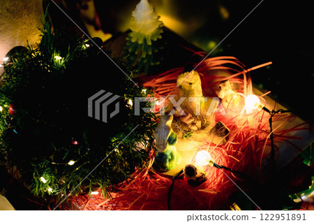 Nativity Scene with Christmas Tree and Balloon Decorations in Office Festive Atmosphere with Santa Claus. High quality photo Nativity Scene with Christmas Tree and Balloon Decorations in Office Festive Atmosphere with Santa Claus. High quality photo 122951891