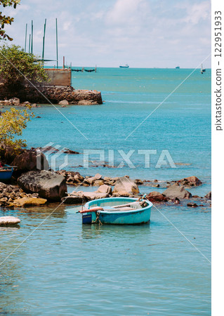 Vung Tau Beach with Blue Sky Flowers and Mother Mary Statue Scenic Coastal View with Coffee Shop Nearby High quality photo Vung Tau Beach with Blue Sky Flowers and Mother Mary Statue Scenic Coastal View with Coffee Shop Nearby High quality photo 122951933