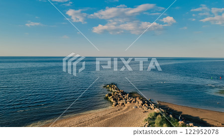 Beautiful seascape with clouds and stones Beautiful seascape with clouds and stones 122952078