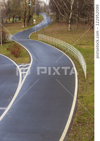 Jogging, walking, cycling path in the park. Jogging, walking, cycling path in the park. 122952099