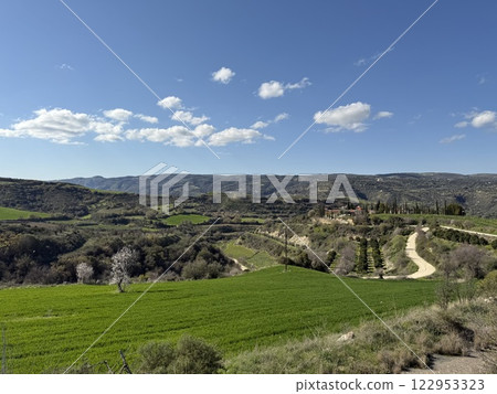 Scenic view of lush green landscape. Spring time, beautiful view of the mountainous area. Scenic view of lush green landscape. Spring time, beautiful view of the mountainous area. 122953323