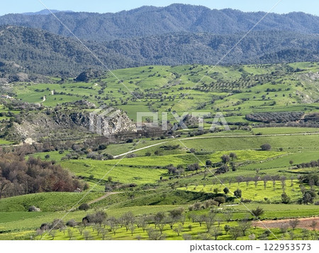 Scenic view of lush green landscape. Spring time, beautiful view of the mountainous area. Scenic view of lush green landscape. Spring time, beautiful view of the mountainous area. 122953573