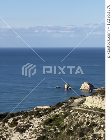 Scenic beach and rock formations in Cyprus. Mediterranean Sea, road, travel, view of mountains and sea. 122953576