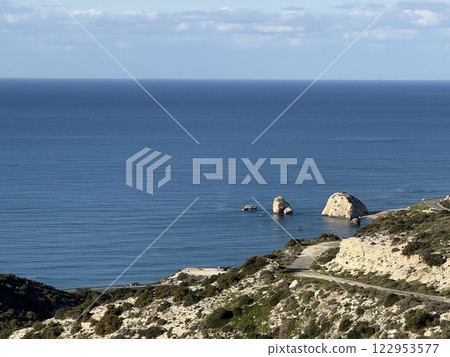 Scenic beach and rock formations in Cyprus. Mediterranean Sea, road, travel, view of mountains and sea. 122953577