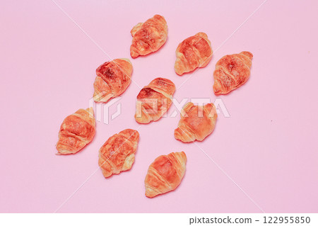 Croissants on a pink background 122955850