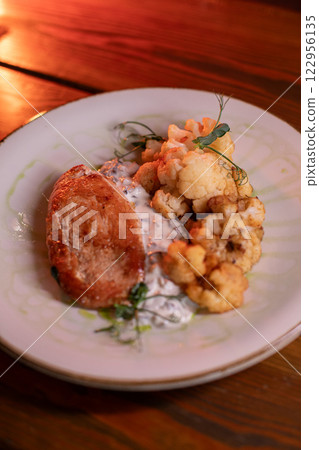 Baked turkey and cauliflower are a delicious dish Baked turkey and cauliflower are a delicious dish 122956135