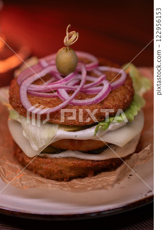 Juicy burger made from draniki and meat patties 122956153